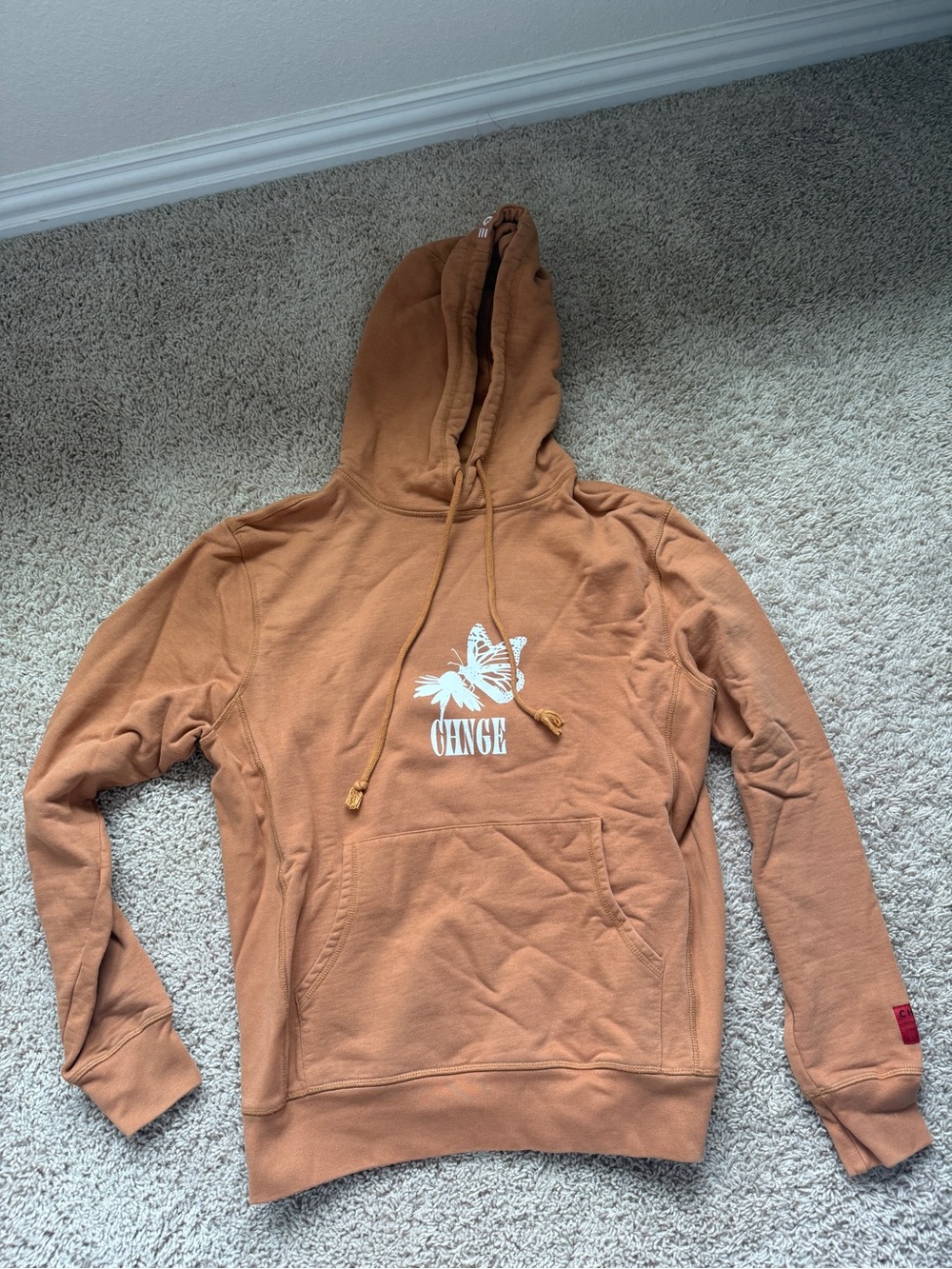 CHNGE Rust Orange Hoodie with White Butterfly Logo